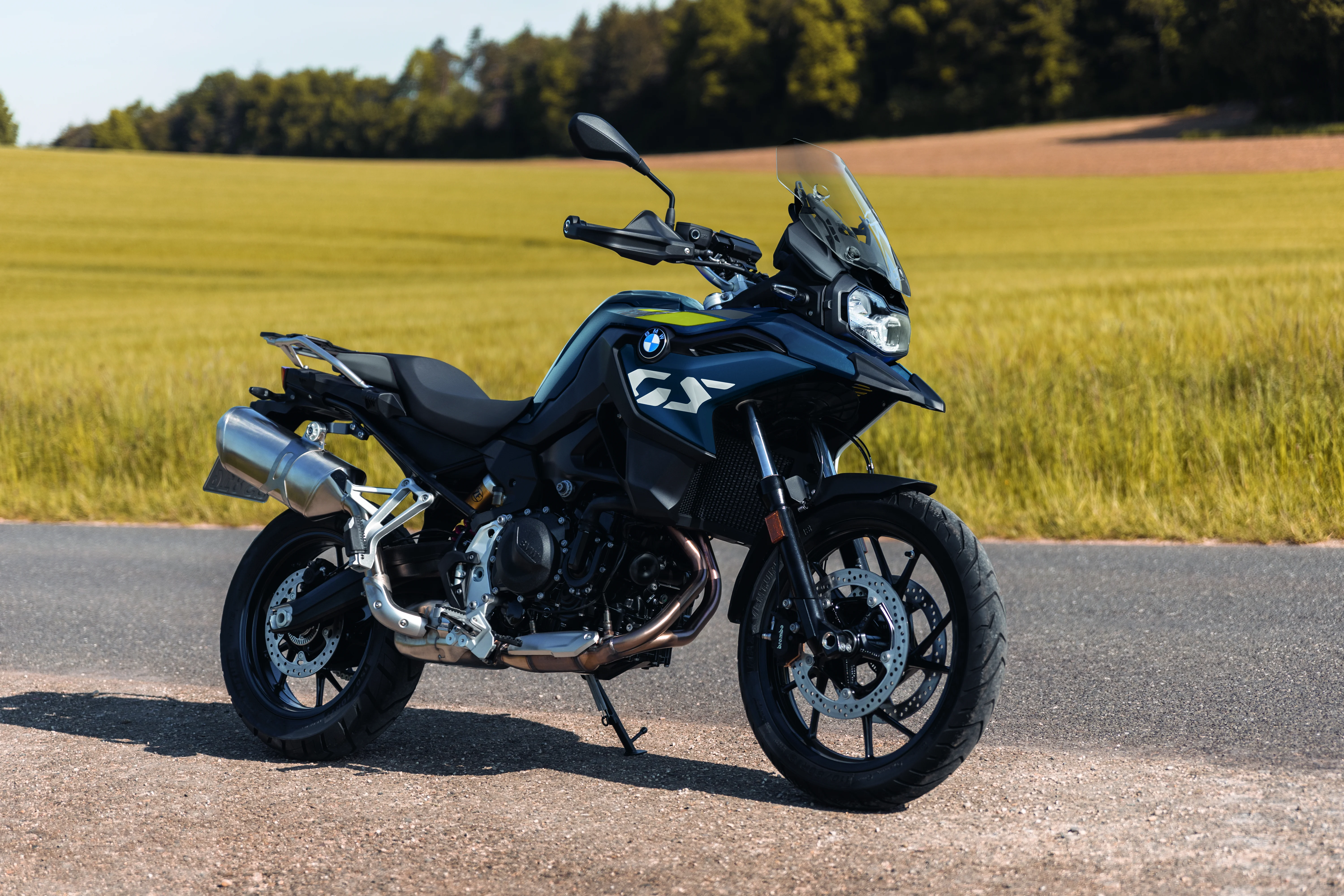 BMW F 800 GS parked on a road shoulder with open fields behind it