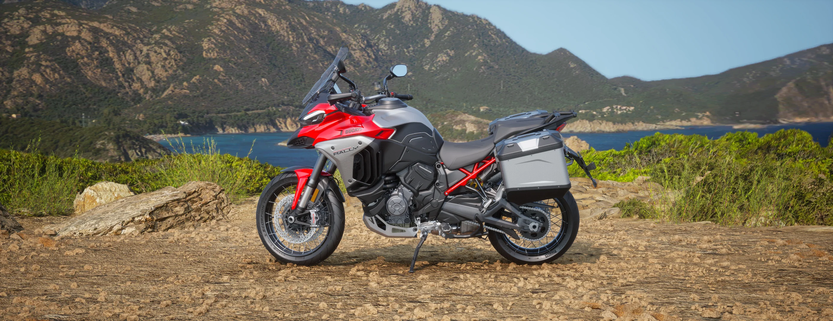 2026 Ducati Multistrada V4 Rally Adventure Travel&Radar red and black left-side profile on off-road terrain