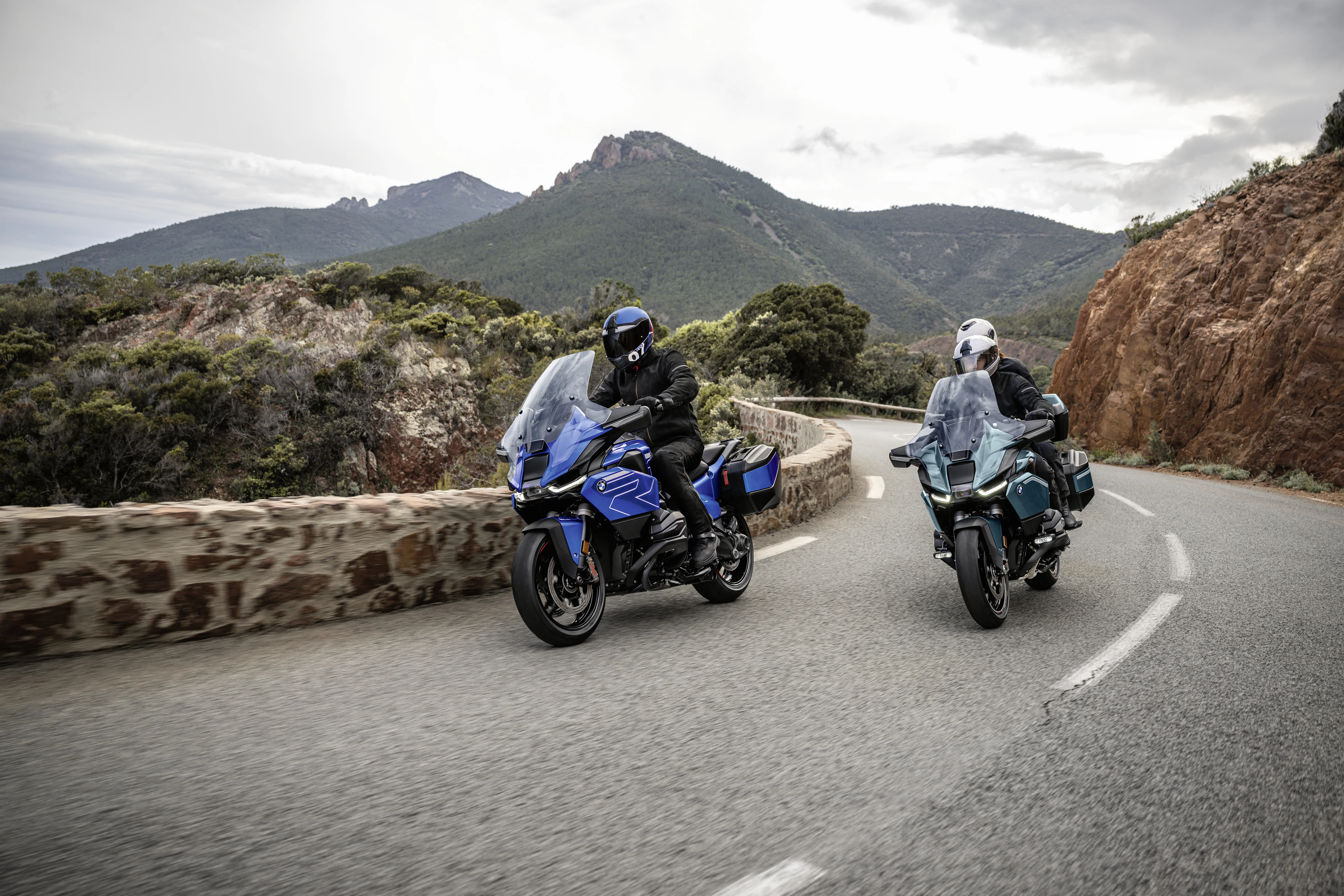 2026 BMW R 1300 RT riding on a curving mountain road